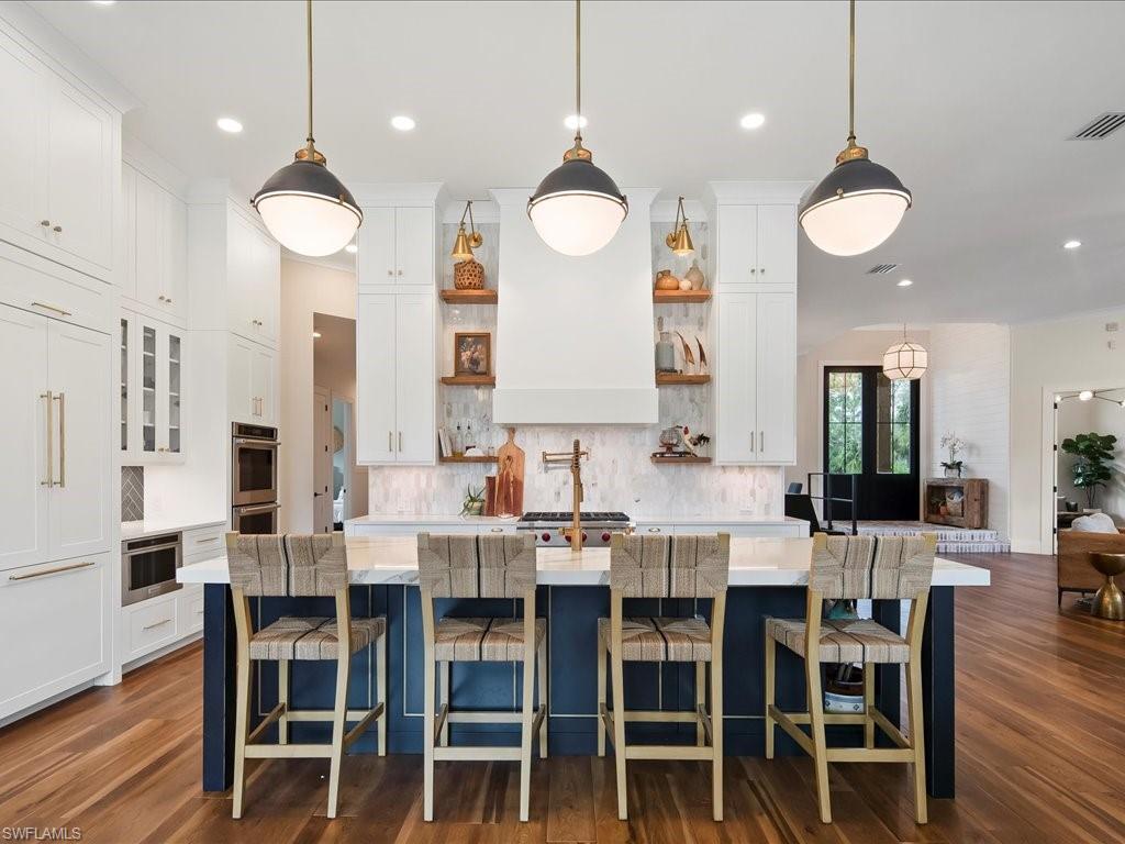 2590 2nd Street Northwest Naples, FL 34120 - Photo 16 of 49 The kitchen was totally reconfigured and transformed into a chef and entertainer's dream! The custom cabinets (throughout the house) were handcrafted by Willow House in Bonita Springs