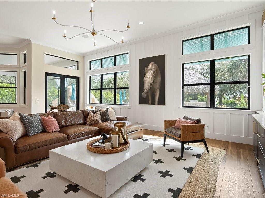 2590 2nd Street Northwest Naples, FL 34120 - Photo 19 of 49 Every window in the home features an incredible, tropical view of the yard.