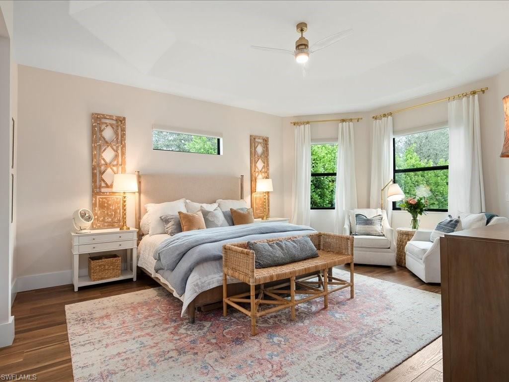2590 2nd Street Northwest Naples, FL 34120 - Photo 20 of 49 The master suite encompasses an entire wing of the home. During the day, plenty of light washes in but the electric room darkening shades keep it perfectly dark for sleeping.