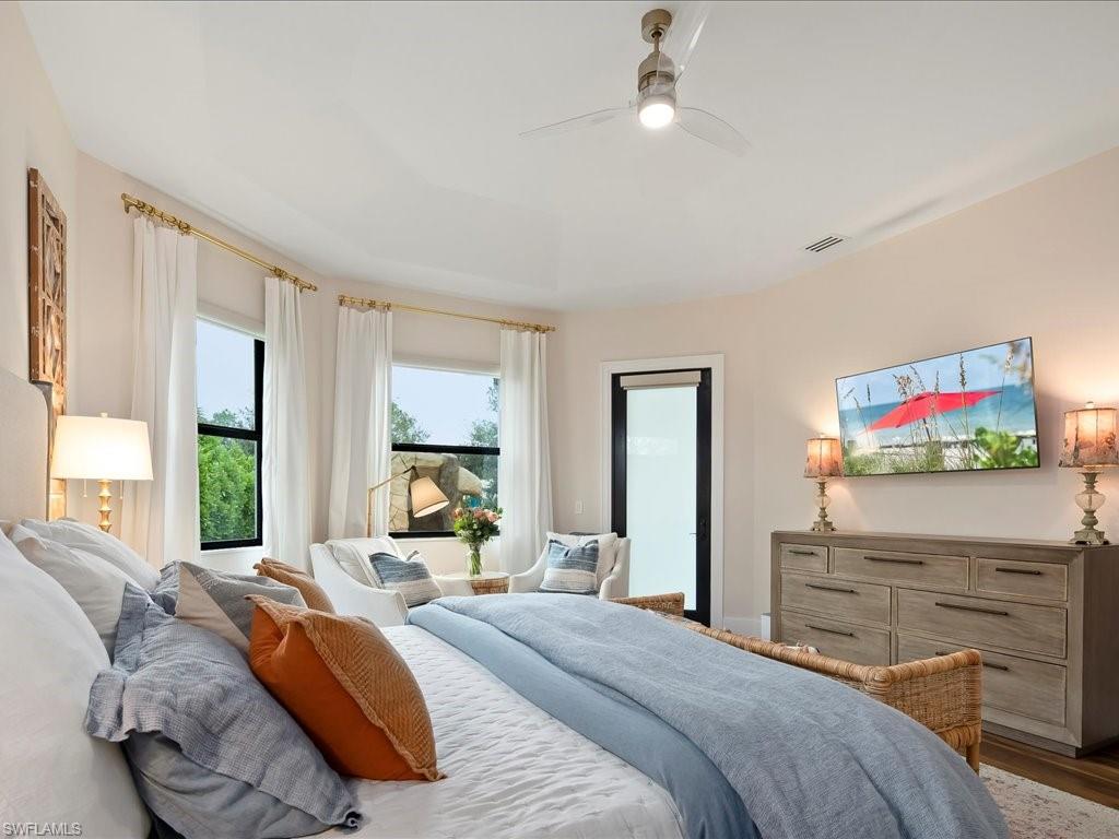 2590 2nd Street Northwest Naples, FL 34120 - Photo 21 of 49 This bedroom is sized generously and easily fits a king sized bedroom suite while still allowing room for a reading nook. It also has direct access to the screened lanai.