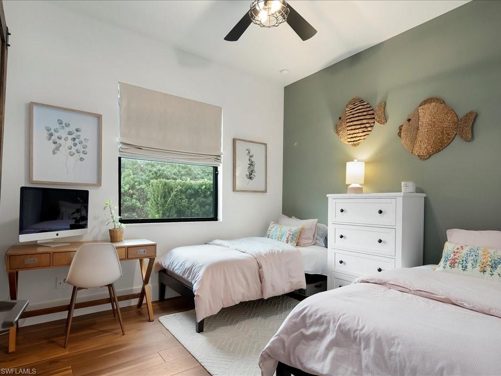 2590 2nd Street Northwest Naples, FL 34120 - Photo 31 of 49 The third bedroom also has a ceiling fan, room darkening shades, and custom PLC closet shelving.