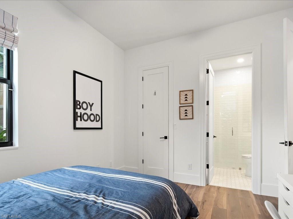 2590 2nd Street Northwest Naples, FL 34120 - Photo 34 of 49 The fourth bedroom makes a perfect guest room with the ensuite bathroom and is the nearest to the garage for easy ingress and egress.