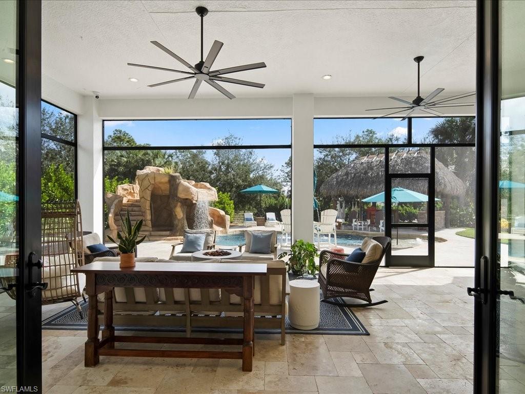2590 2nd Street Northwest Naples, FL 34120 - Photo 37 of 49 You can access the HUGE screened lanai from inside the house four different ways. It truly is an indoor/outdoor space.