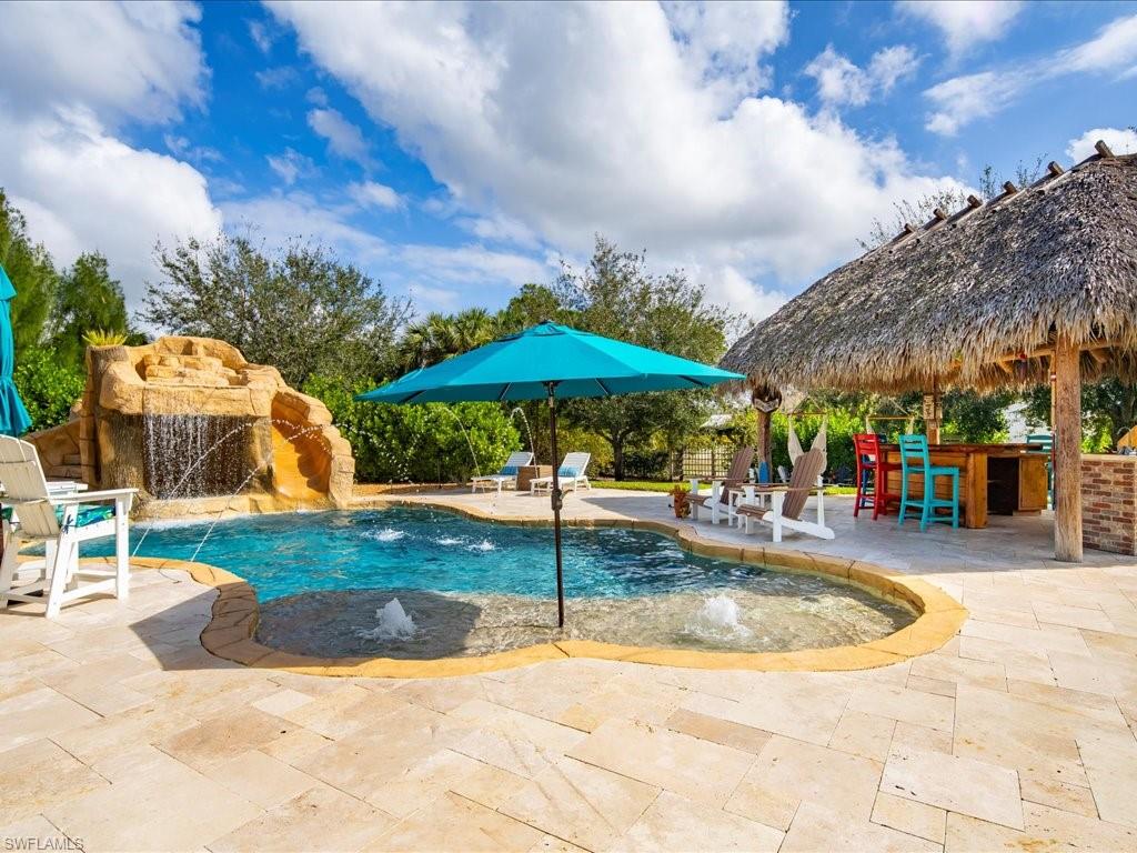 2590 2nd Street Northwest Naples, FL 34120 - Photo 39 of 49 As if the home itself wasn't incredible enough...wait until you step outside and see the tropical paradise that awaits your family, friends, and guests! If you're looking for a place to entertain and have FUN, this is IT!