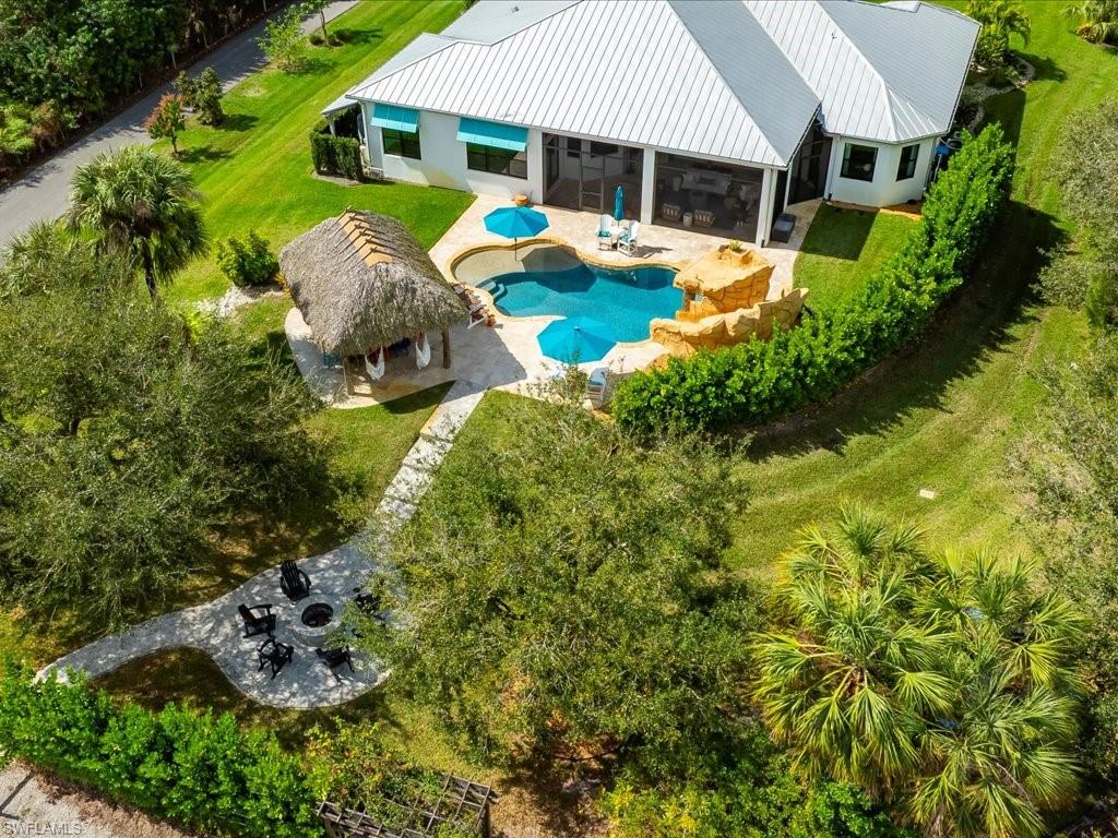 2590 2nd Street Northwest Naples, FL 34120 - Photo 45 of 49 There's truly nothing lacking in this property. The current homeowners love hosting all of their friends and family for an annual summer kickoff and you can see why! This property is the epitome of what "endless summer" is all about.