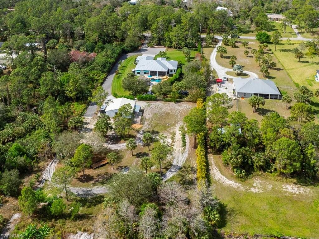 2590 2nd Street Northwest Naples, FL 34120 - Photo 46 of 49 This 2.75 acres is a true homestead. For peace of mind and uninterrupted living, the entire home was connected to a Generac generator with a 1,000 gallon buried propane tank in 2021.