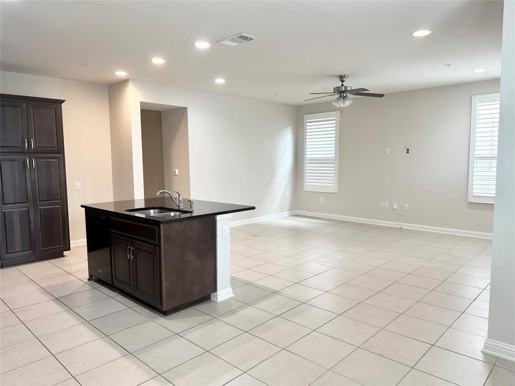 6814 East Riverside Drive, Unit 26 Austin, TX 78741 - Photo 5 of 21 An open-concept living space with a functional kitchen island and bright natural illumination.