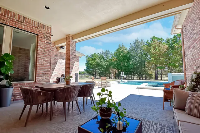a view of a chairs and table in patio