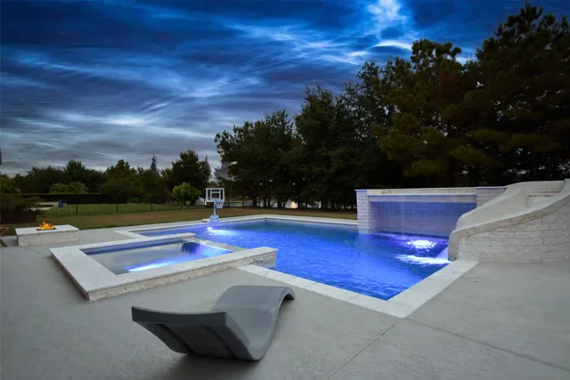 a view of outdoor space with swimming pool and seating