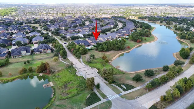 an aerial view of a city with lake view