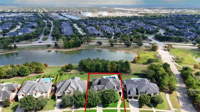 a living room with furniture a fireplace and a potted plant
