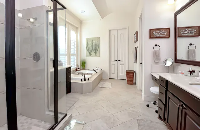 a bath tub sitting in a bathroom next to a window