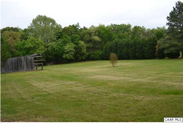 9991 Bridgeport Road Arvonia, VA 23004 - Photo 21 of 24 Backyard and outbuilding. Huge garden spot to the left (out of view here).