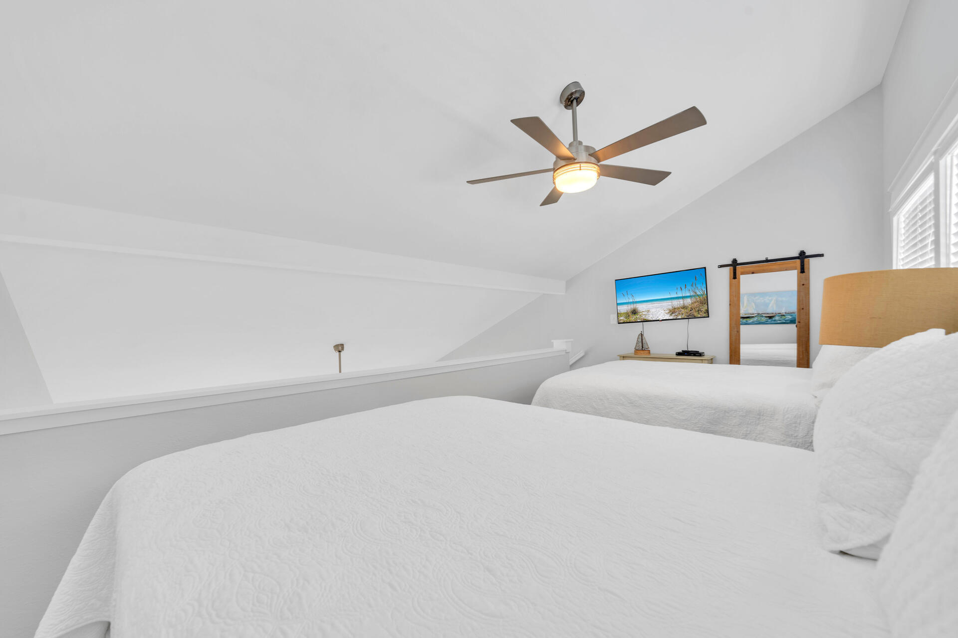 145 Beachfront Trail, Unit 303A Santa Rosa Beach, FL 32459 - Photo 17 of 38 a bedroom with a bed and a ceiling fan