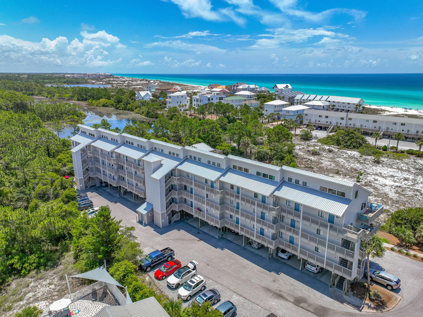 145 Beachfront Trail, Unit 303A Santa Rosa Beach, FL 32459 - Photo 21 of 38 a view of a balcony with an outdoor seating