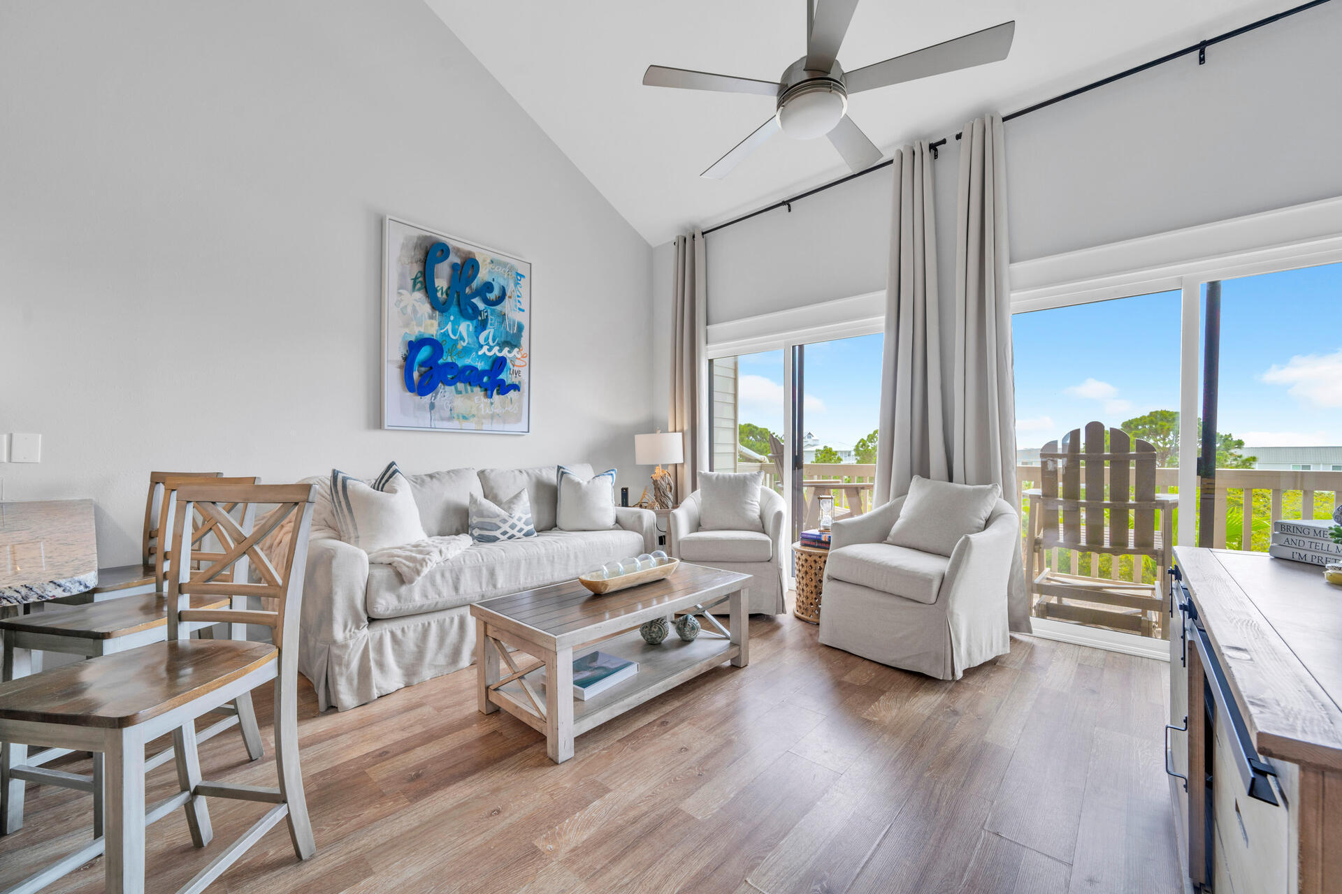 145 Beachfront Trail, Unit 303A Santa Rosa Beach, FL 32459 - Photo 4 of 38 a living room with furniture and a large window