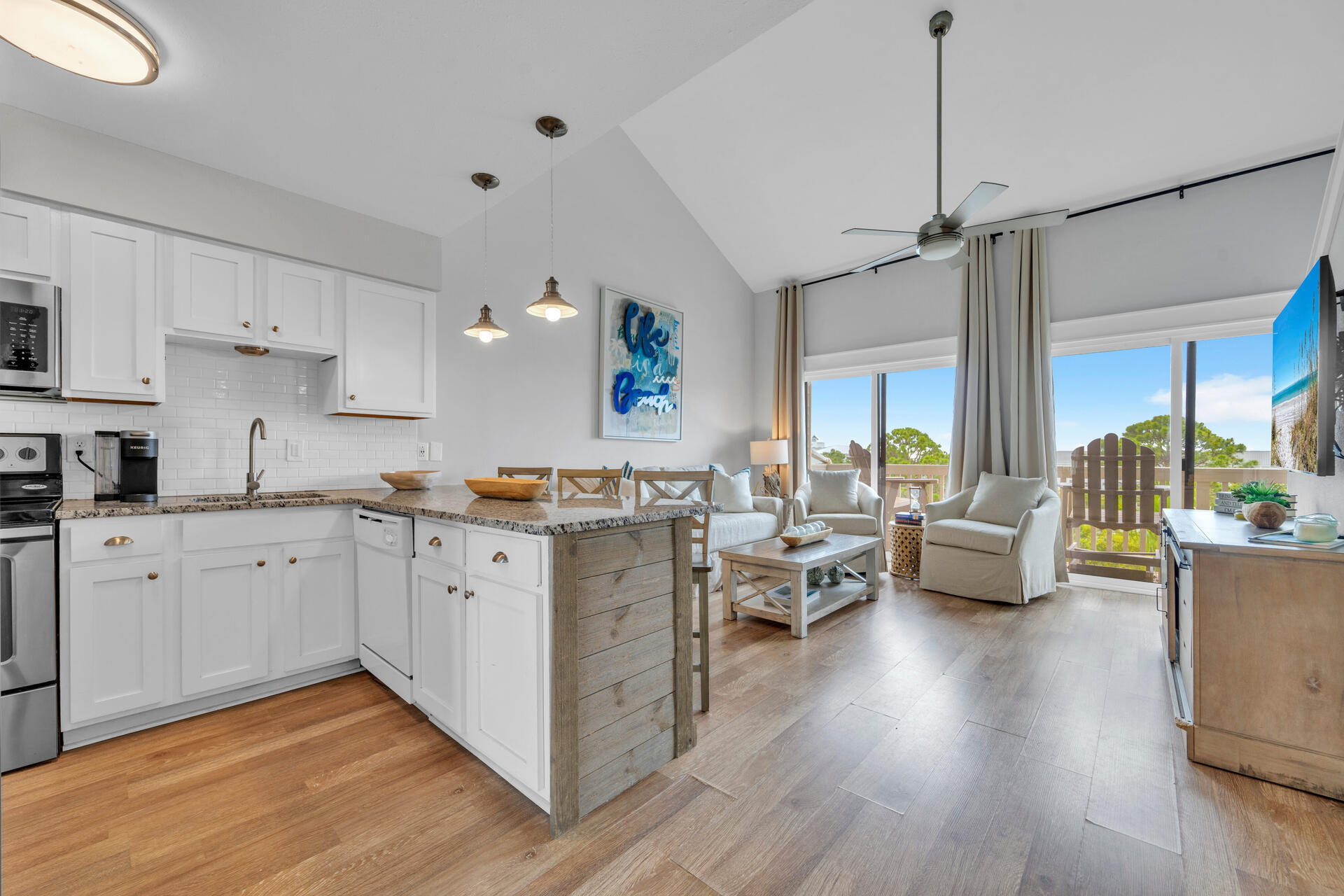 145 Beachfront Trail, Unit 303A Santa Rosa Beach, FL 32459 - Photo 5 of 38 a open a kitchen with white cabinets and wooden floor