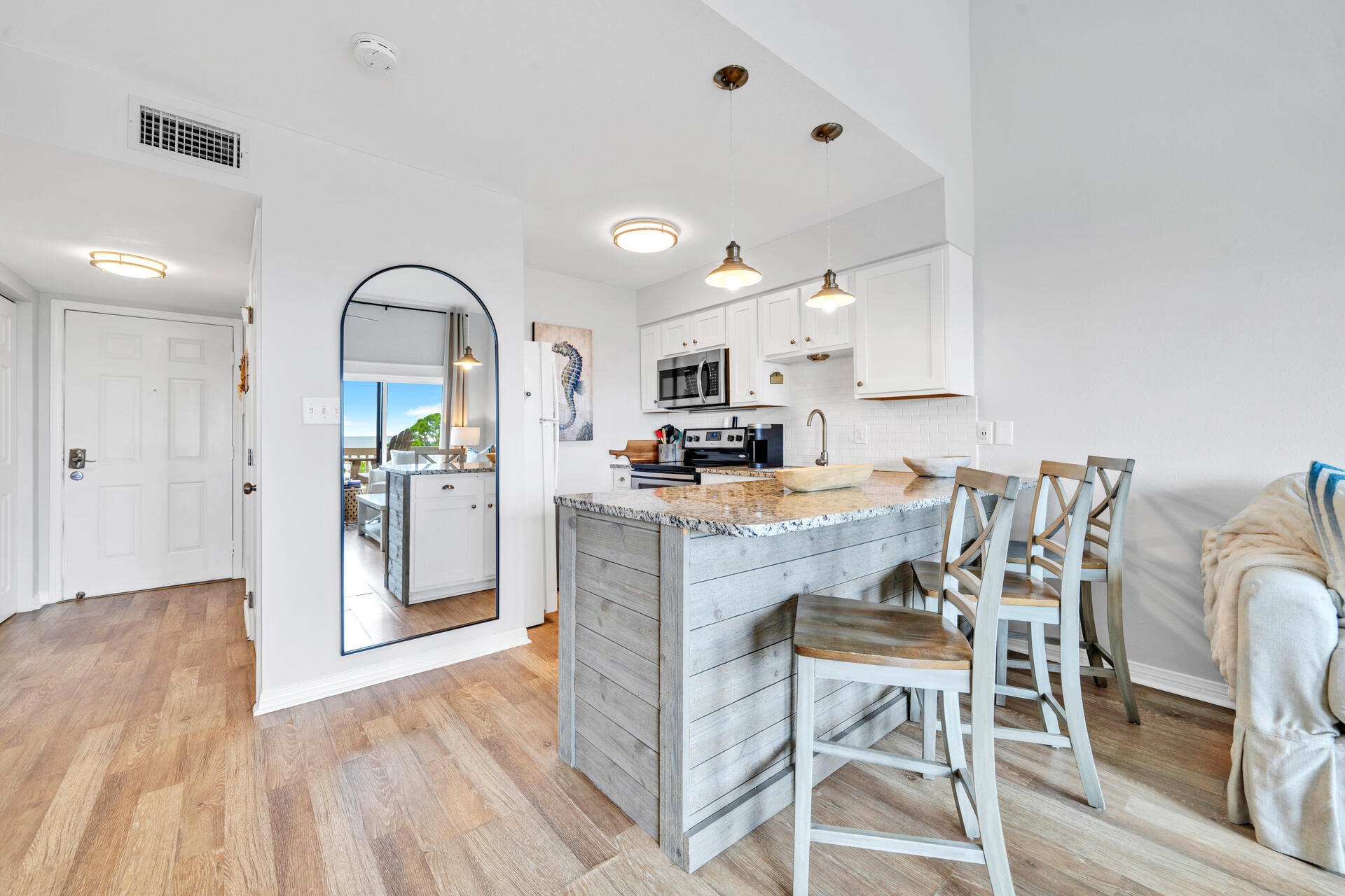145 Beachfront Trail, Unit 303A Santa Rosa Beach, FL 32459 - Photo 7 of 38 a living room with stainless steel appliances kitchen island granite countertop furniture and a view of kitchen