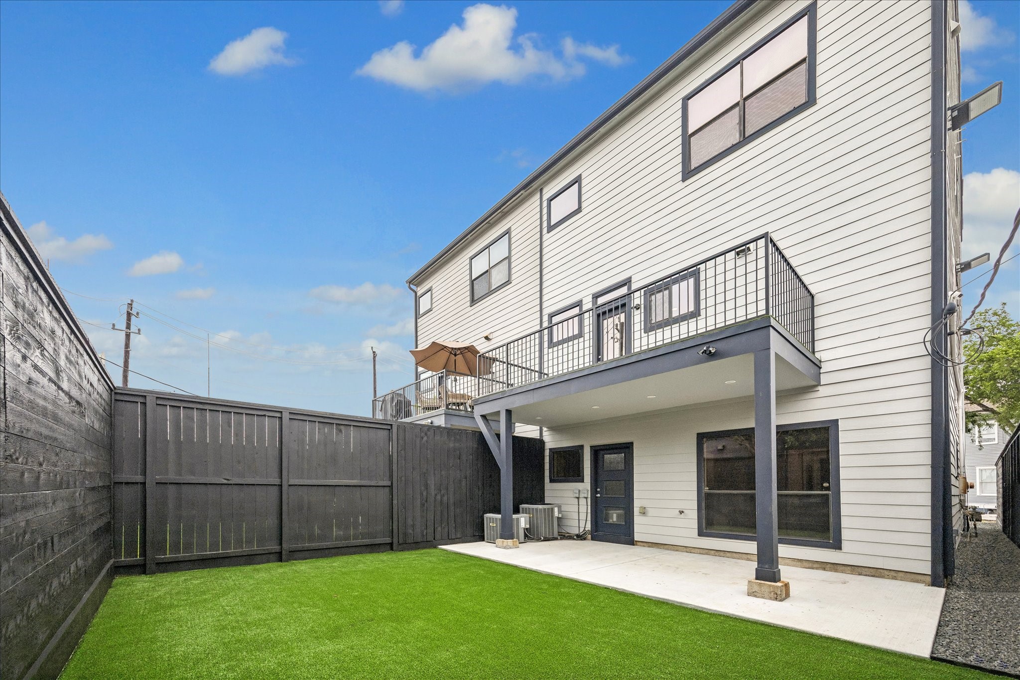 2510 Genesee Street Houston, TX 77006 - Photo 36 of 40 Backyard is features a concrete patio area new fence and new synthetic turf grass
