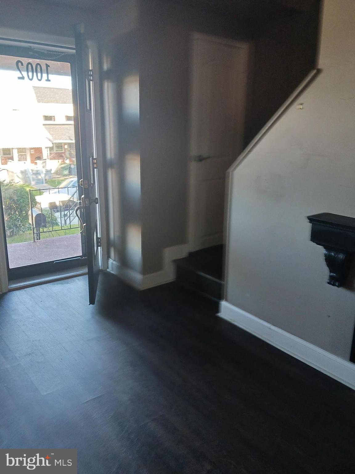 1002 Stamford Road Baltimore, MD 21229 - Photo 14 of 16 a view of empty room with wooden floor and fan