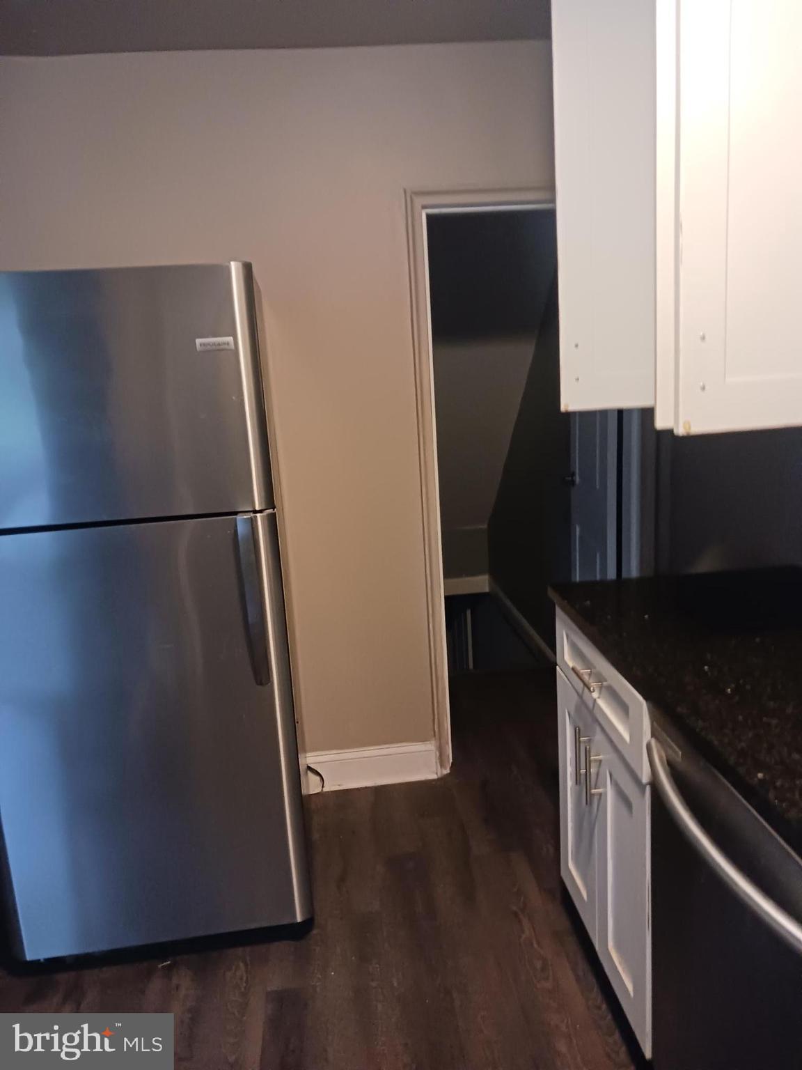 1002 Stamford Road Baltimore, MD 21229 - Photo 4 of 16 a kitchen with a refrigerator and a stove