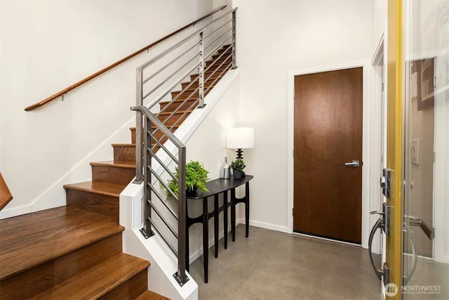 a bedroom with a bed and a painting on the wall