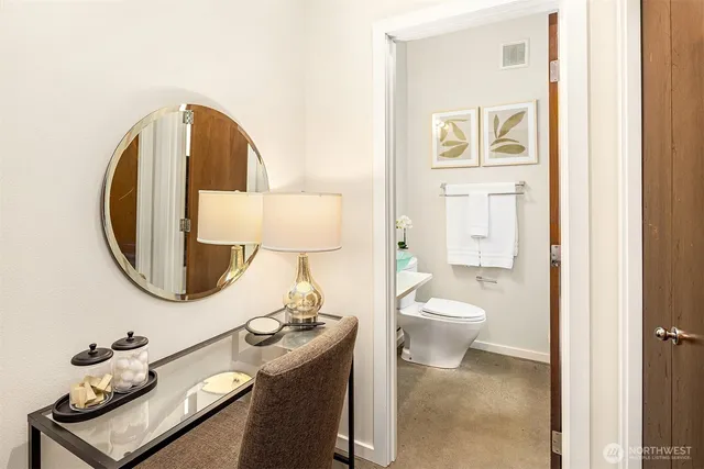 a bathroom with a toilet and a sink