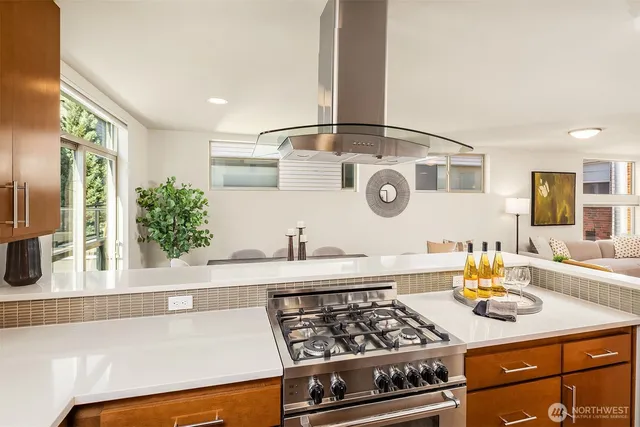 a kitchen with a stove and a white refrigerator