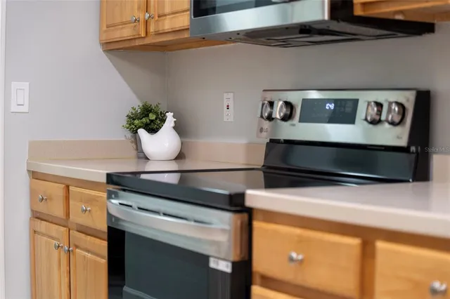 a kitchen with a stove and cabinets