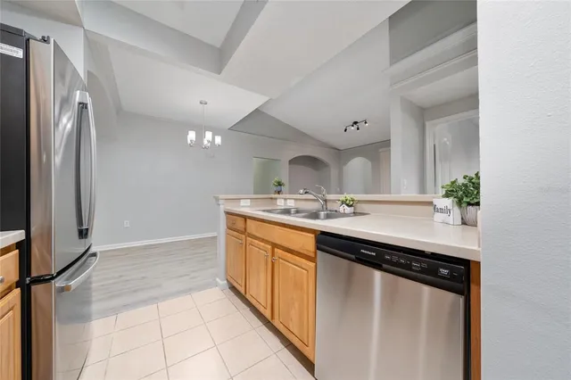 a kitchen with stainless steel appliances granite countertop a stove a microwave and cabinets