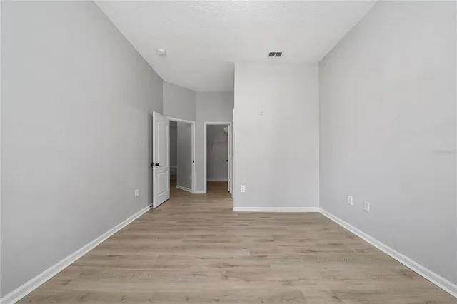 a bathroom with a double vanity sink a toilet and a bathtub