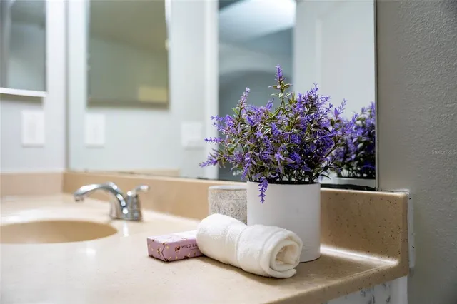 a room with a cabinet and a potted plant
