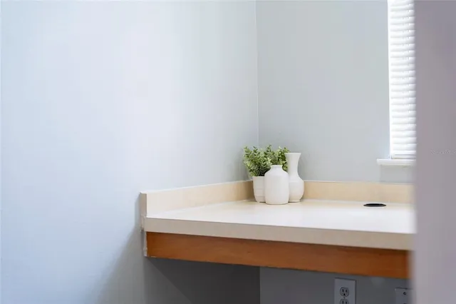a utility room with cabinets washer and dryer