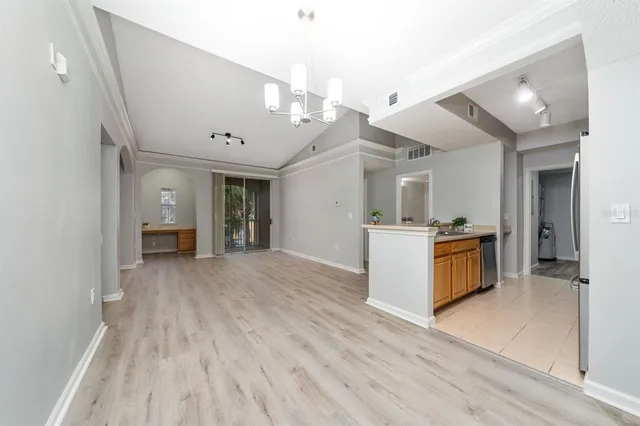 a view of a kitchen cabinets and wooden floor