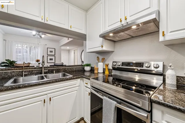 a spacious bedroom with a bed a couch and a window