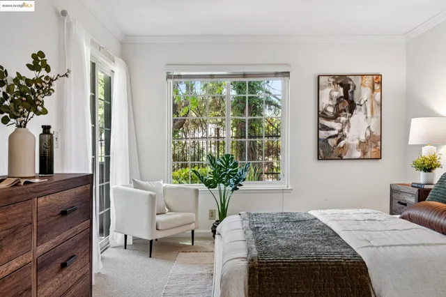 a bathroom with a granite countertop sink a toilet a mirror a vanity and shower