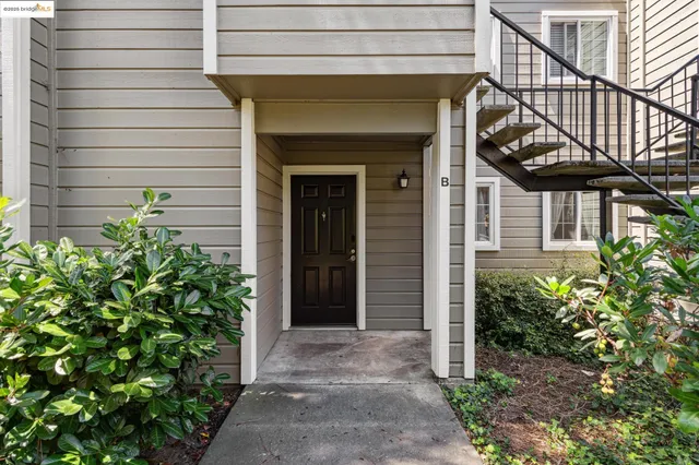 a living room with furniture and a clock