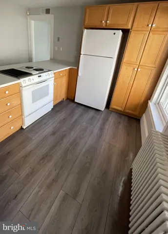 a living room with furniture and windows