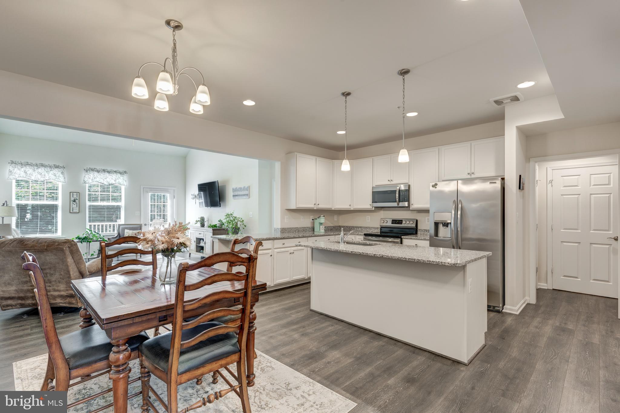 2910 Union Square Road, Unit 34 New Windsor, MD 21776 - Photo 11 of 49 a view of a dining room kitchen furniture and a chandelier