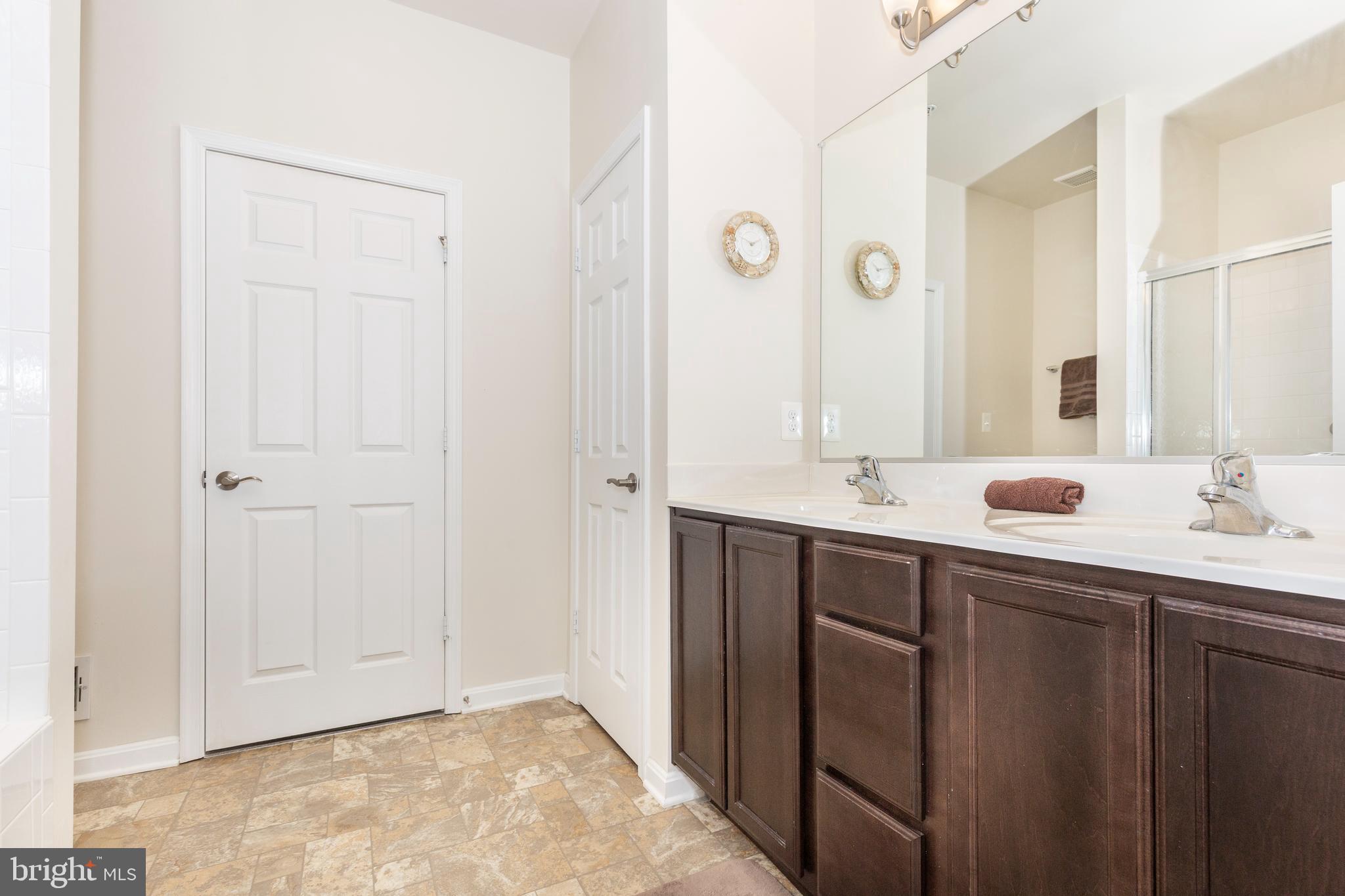 2910 Union Square Road, Unit 34 New Windsor, MD 21776 - Photo 20 of 49 a bathroom with a double vanity sink and a mirror
