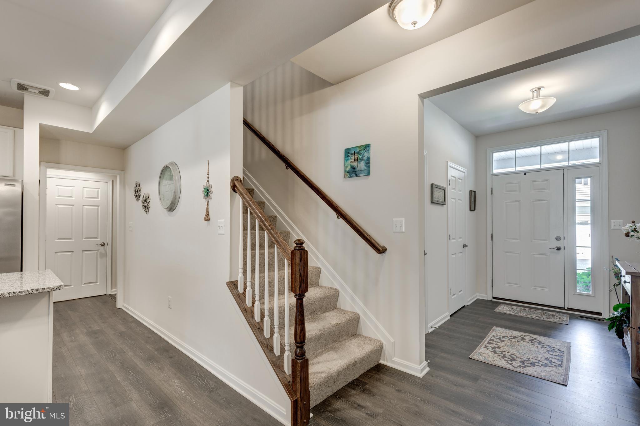 2910 Union Square Road, Unit 34 New Windsor, MD 21776 - Photo 25 of 49 a view of entryway with wooden floor and stairs