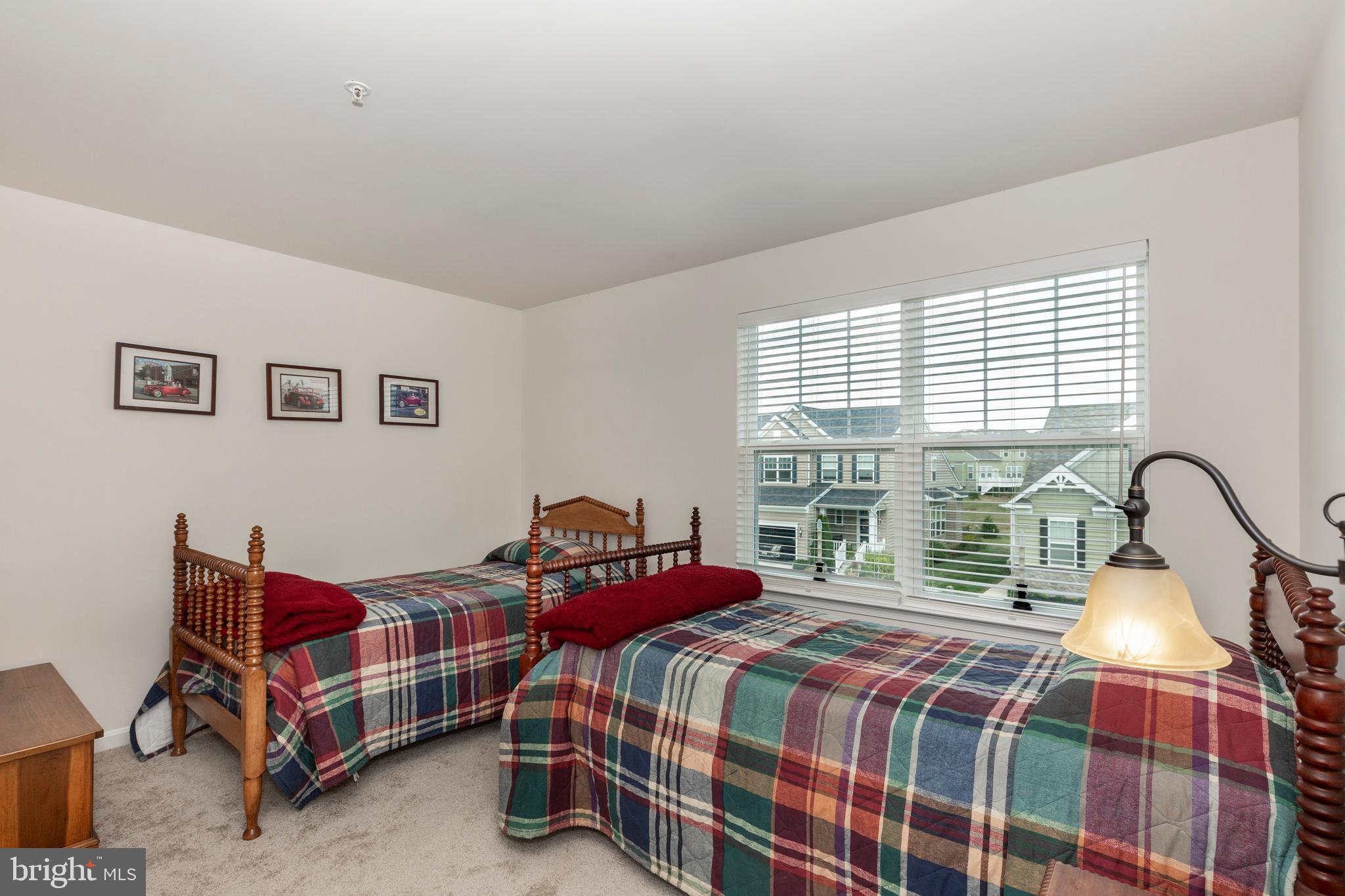 2910 Union Square Road, Unit 34 New Windsor, MD 21776 - Photo 32 of 49 a bedroom with a bed and a dresser next to a window