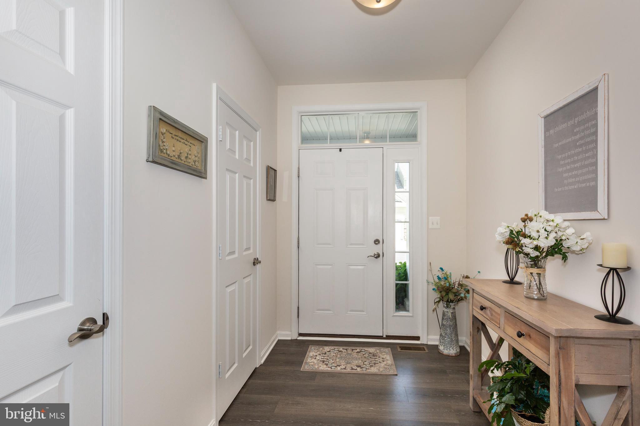 2910 Union Square Road, Unit 34 New Windsor, MD 21776 - Photo 4 of 49 a view of entryway with furniture and hardwood floor