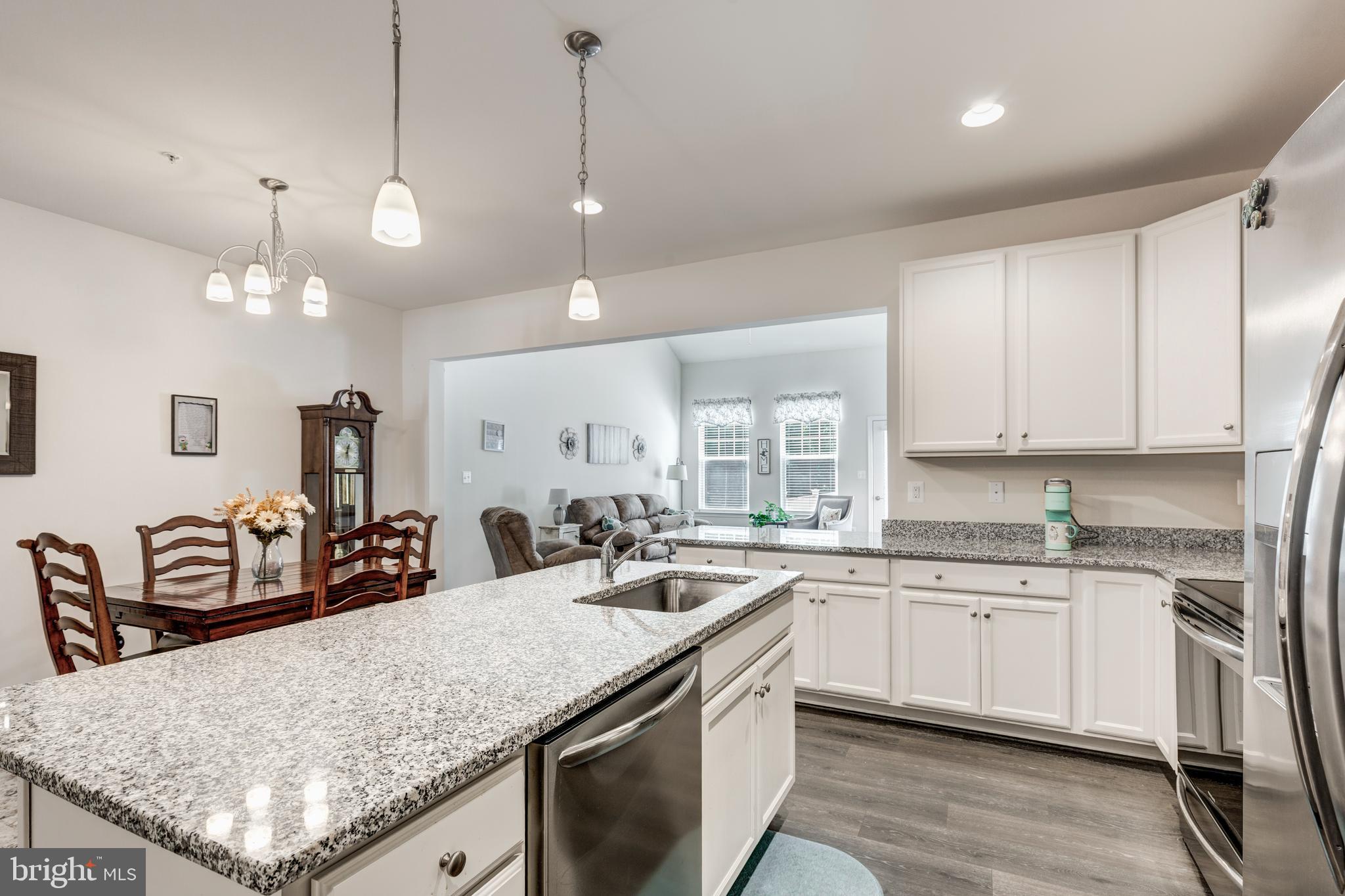 2910 Union Square Road, Unit 34 New Windsor, MD 21776 - Photo 7 of 49 a kitchen with stainless steel appliances granite countertop a sink a stove and a wooden floors