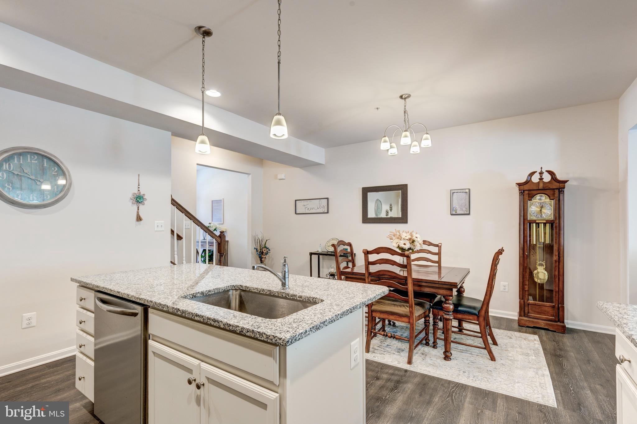 2910 Union Square Road, Unit 34 New Windsor, MD 21776 - Photo 8 of 49 a kitchen that has a cabinets a sink and chairs in it