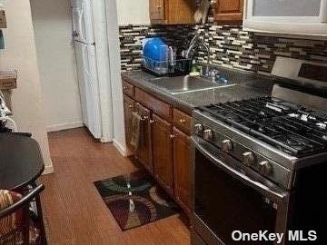 a kitchen with a stove and a sink