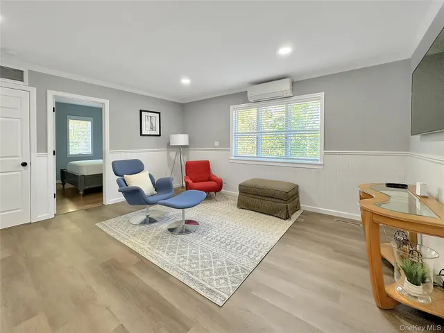a living room with furniture and a window
