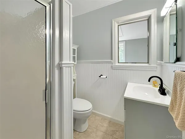 a bathroom with a toilet sink and shower
