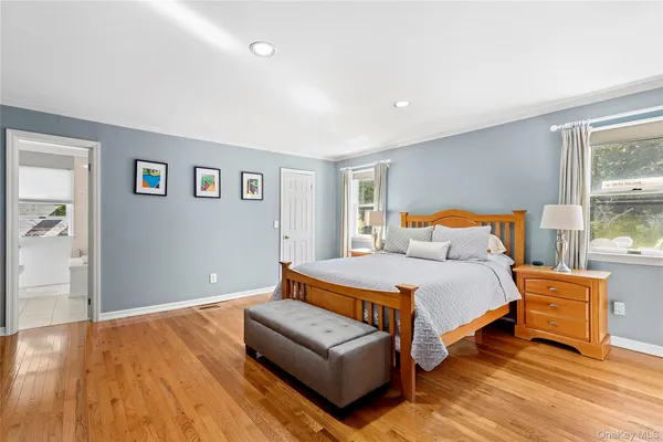 a bedroom with a bed and a couch