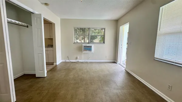 an empty room that has a window